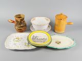 many different types of plates and cups on the table
