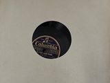an old record in a box with a label on it