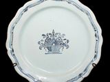 a white plate with a blue and white design on it