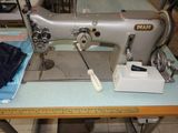 a sewing machine sitting on a table in a room