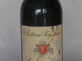 a bottle of wine that is sitting on a table