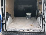 a white van that is parked in the parking lot