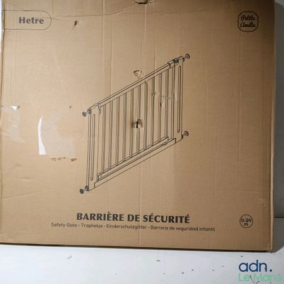 cardboard box with a drawing of a security gate on top of it