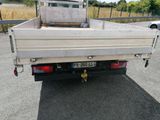 a white truck that is parked on the side of the road