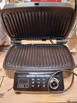 an image of an electric grill on a box