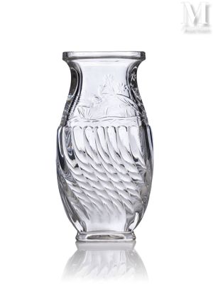 a glass vase with a design on it on a white surface