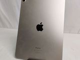 the back of an apple ipad with a silver back and a black back