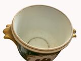 a small bowl with a handle and a handle on it