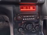 a car dashboard with a clock and radio in it