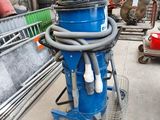 a blue machine that is sitting on a cart