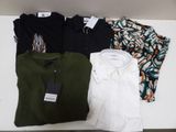 three men ' s shirts and a women ' s shirt on a shelf