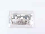 a picture of a silver bar with a picture of a castle on it