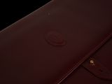 the large brown leather briefcase is open and ready to be used
