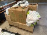 a pile of boxes and bags sitting on the floor
