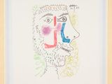 an image of a drawing of a man ' s face in a wooden frame