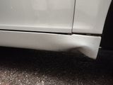 a close up of a car ' s front bumper and fender