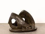 bronze sculpture of a woman ' s foot resting on a plate