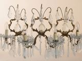 three chandeliers hanging from the ceiling in a room