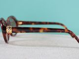 the glasses are made of tortoises and have gold accents