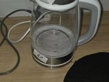 a black and white coffee pot and a black and white coffee pot on a wooden table