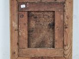 an old wooden picture frame with a piece of wood sticking out of it
