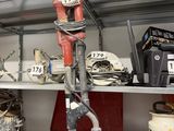 many different tools on the shelves in the room
