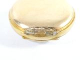 an image of a close up of a gold pocket watch on a white surface