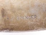 a close up of a piece of metal with a name on it
