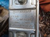 a close up of a metal box with a nut on it
