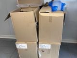 boxes stacked on top of each other on a pallet in a room