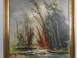une peinture à l'huile représentant une rivière et des arbres dans un cadre doré