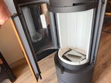 a person standing next to a machine that is on the floor