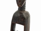 wooden sculpture of a woman with a headdress on a white background