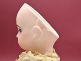 a small doll that is sitting on a table