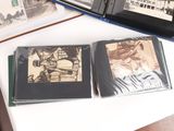 two cd ' s sitting on a table next to each other
