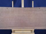 an image of a wooden easel with a piece of wood on it