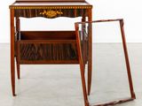 a small wooden table with a mirror on top of it