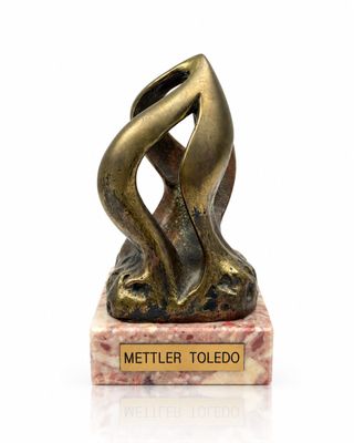 statue of a woman holding a vase on a marble base