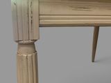 a small table with a wooden top on a gray background