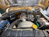 a picture of a car engine with its hood open