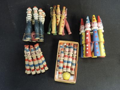 a lot of small wooden toys that are on the table
