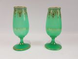 pair of green glass goblets with gold trimmings