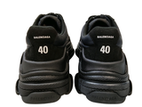 a pair of black sneakers with the number 40 on them
