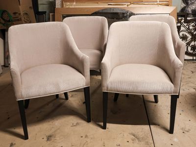two chairs sitting next to each other in a room