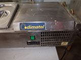 a metal counter top with a metal pan on top of it