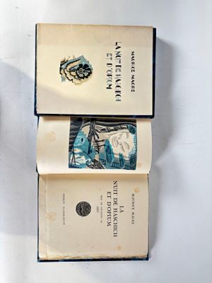 two books that are open on a table