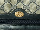 a close up of a guccissi bag with a zipper