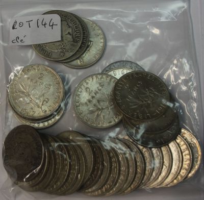 a lot of coins in a bag with a price tag on it