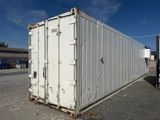 a white container sitting in the middle of a parking lot