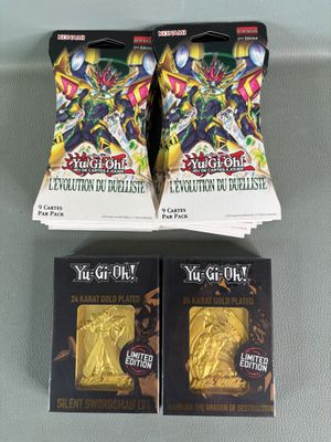 two packs of yu - gi oh trading cards are on a table